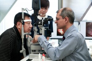 Dr Ajeet Madhav Wagle examine patient's eye using slit lamp