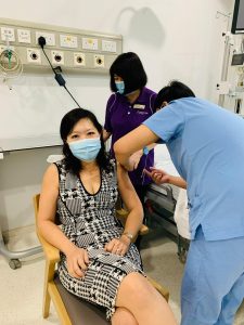Dr Joy receivimg her COVID-19 vaccination.